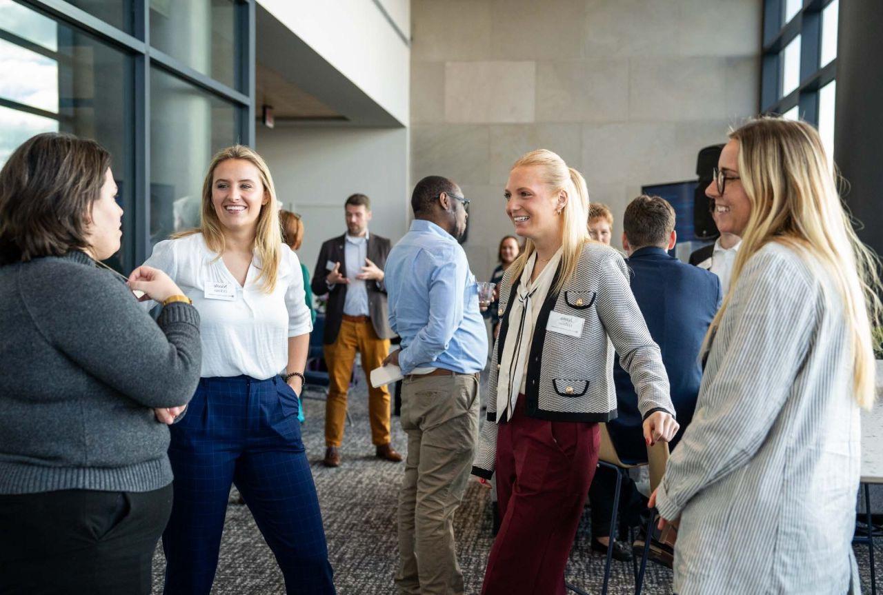 Image of Talent Link students enthusiastically talking at event